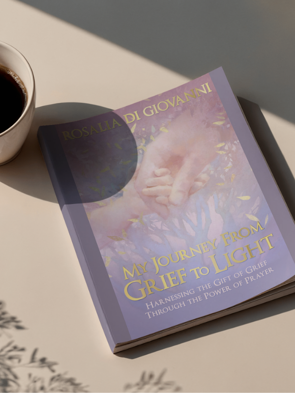 My Journey from Grief to Light by Rosalia Di Giovanni book on a table
